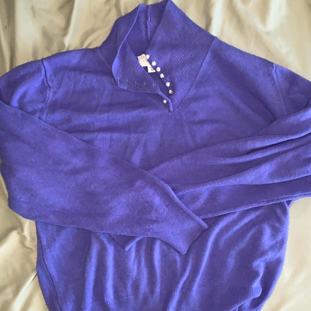 purple sweater with pearl beads on neckline